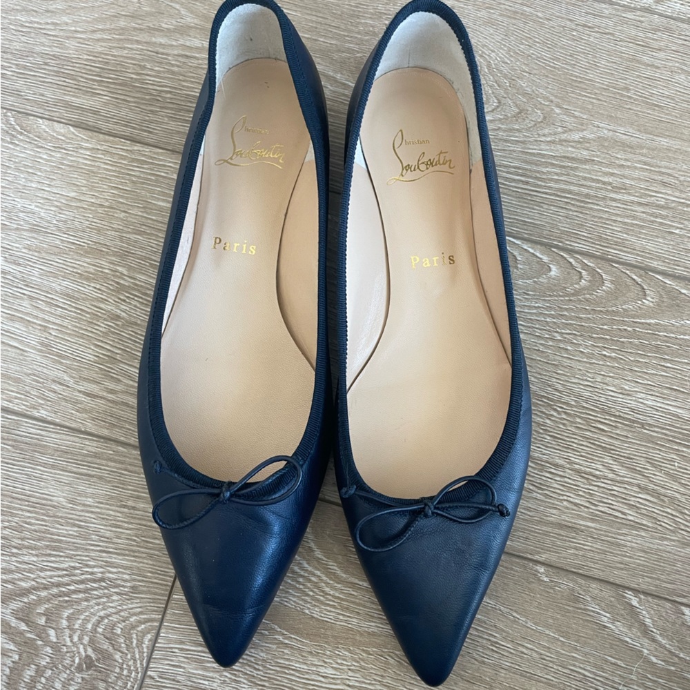 Christian Louboutin Navy Flats with spiked heel. Barely worn